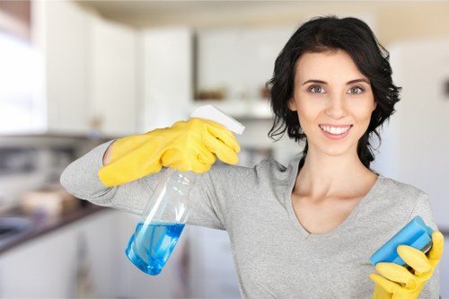 Cleaner removing waste from an elegant Belgravia townhouse entrance