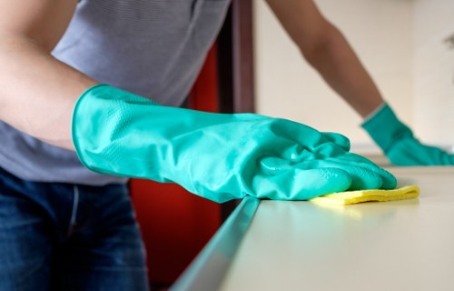 Local technician inspecting a mattress for stains and dust